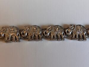 Silvertone elephant Link bracelet with Green, pink gold, and blue swirls